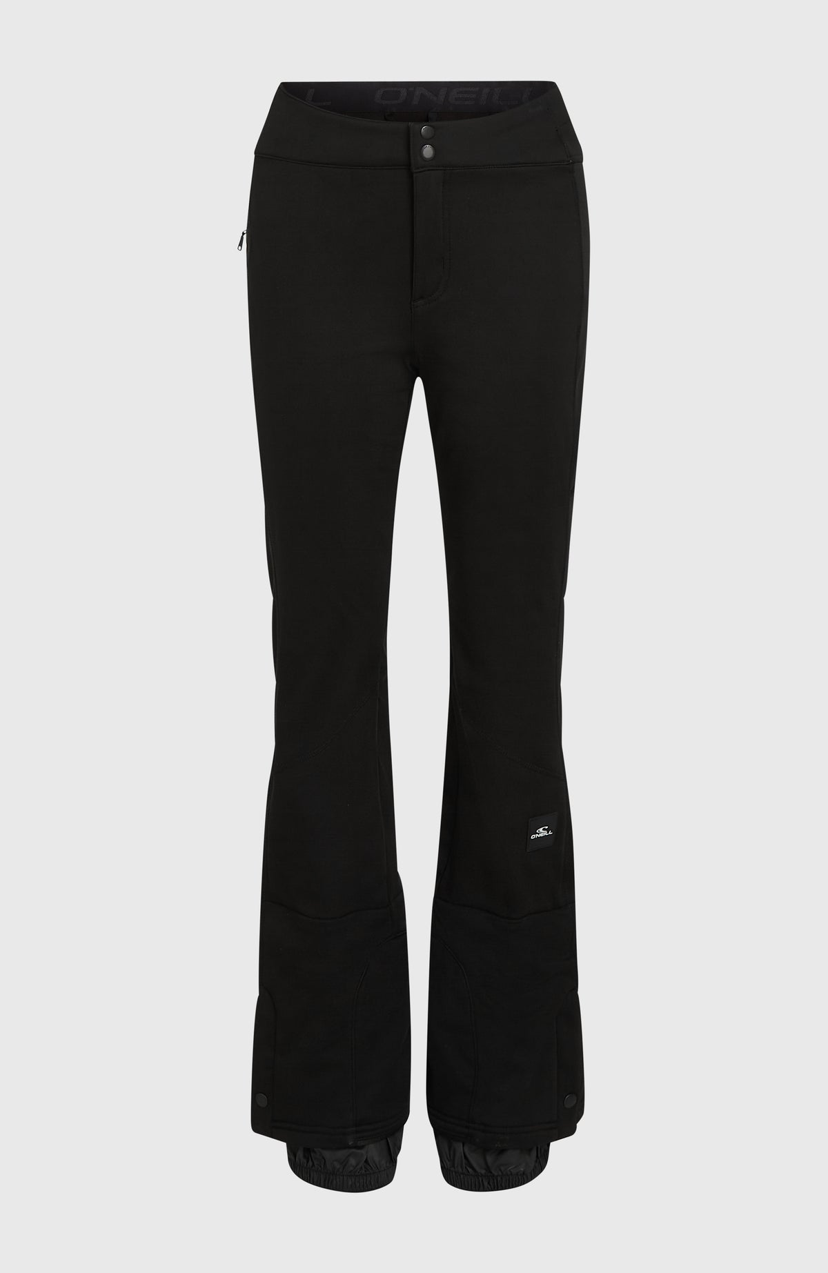 Schwarze FWC'Cruz Softshell-Skihose für Damen, freigestellt von vorne mit sichtbarem Schneefang am Saum