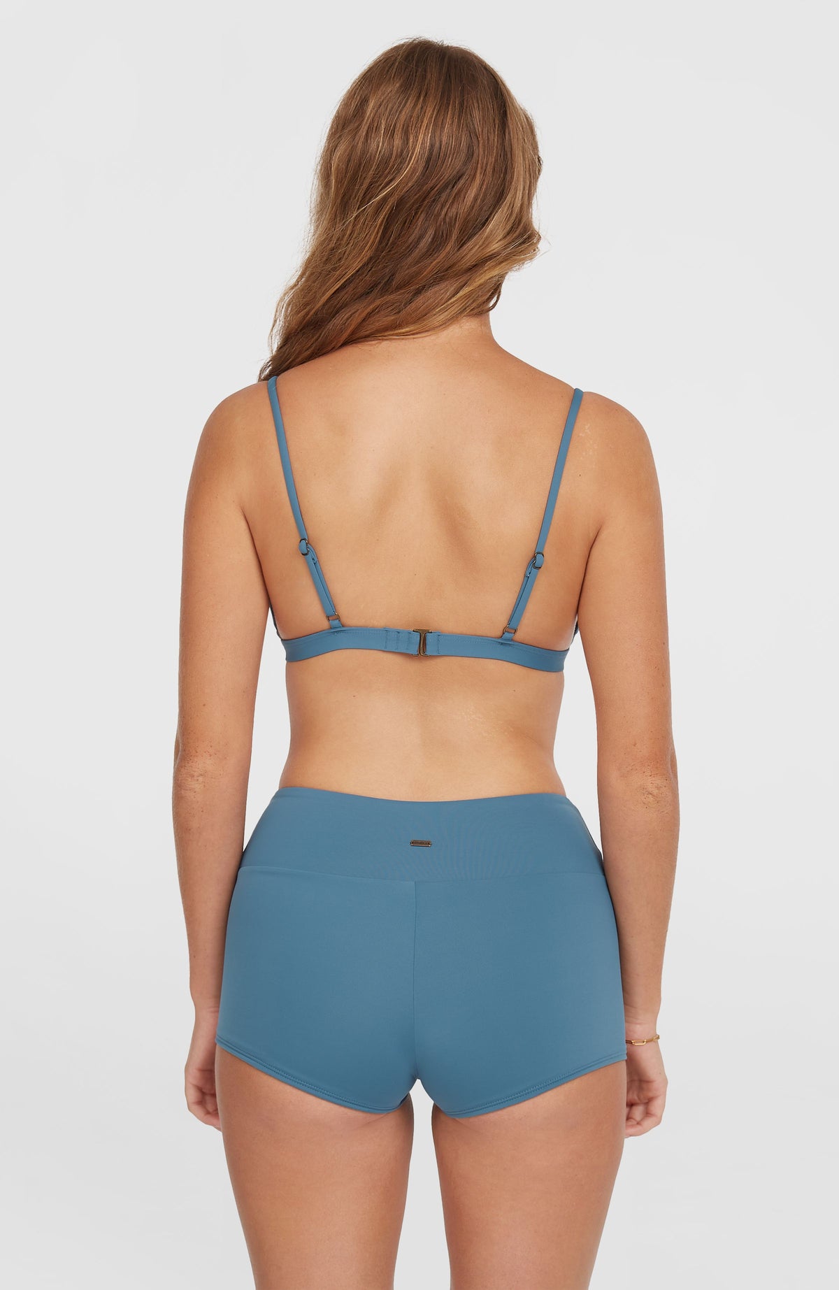 Grenada Bikinihose für Damen, blau, getragen am Model in rückseitiger Halbaufnahme