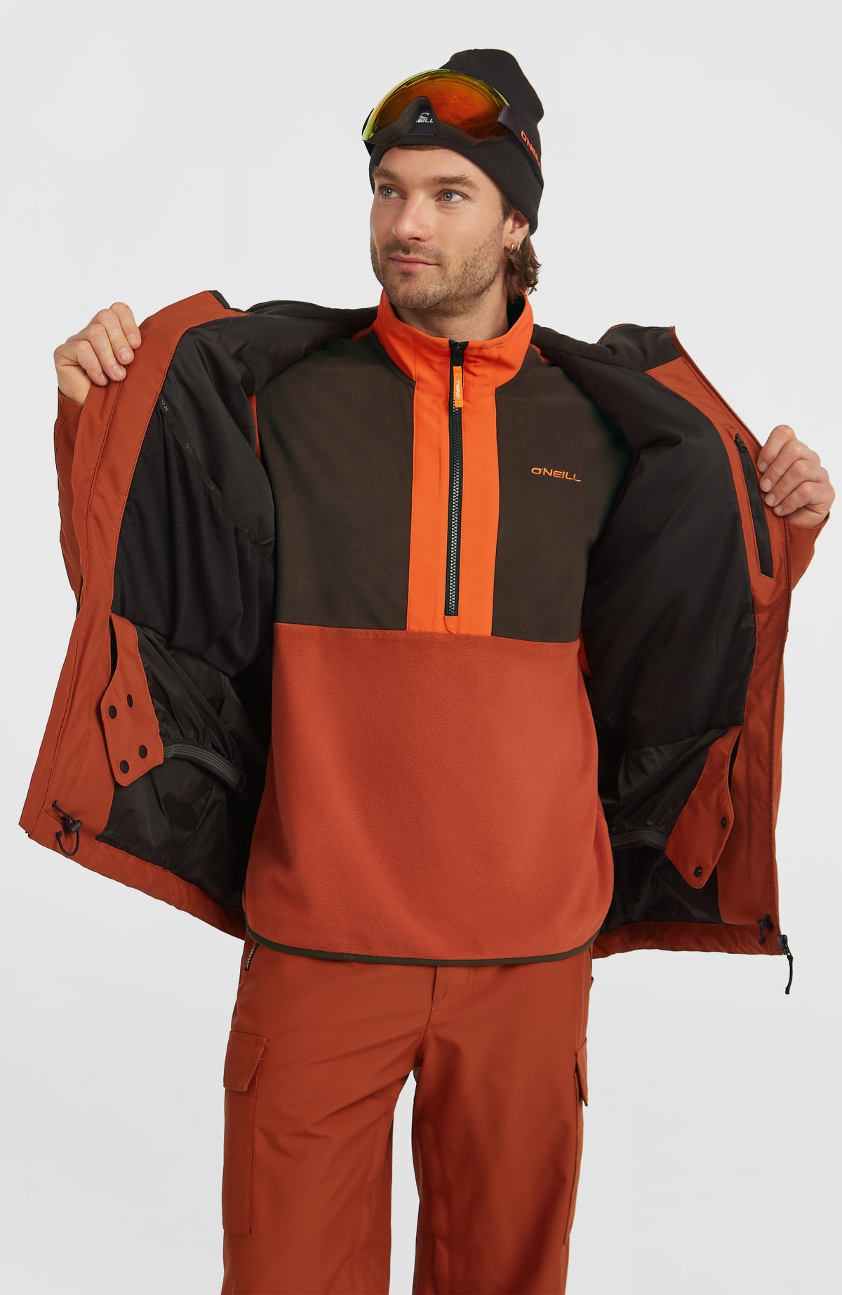 FWC'Cruz Skijacke für Herren, orange, geöffnete Vorderansicht am Model mit Blick auf das Innenfutter