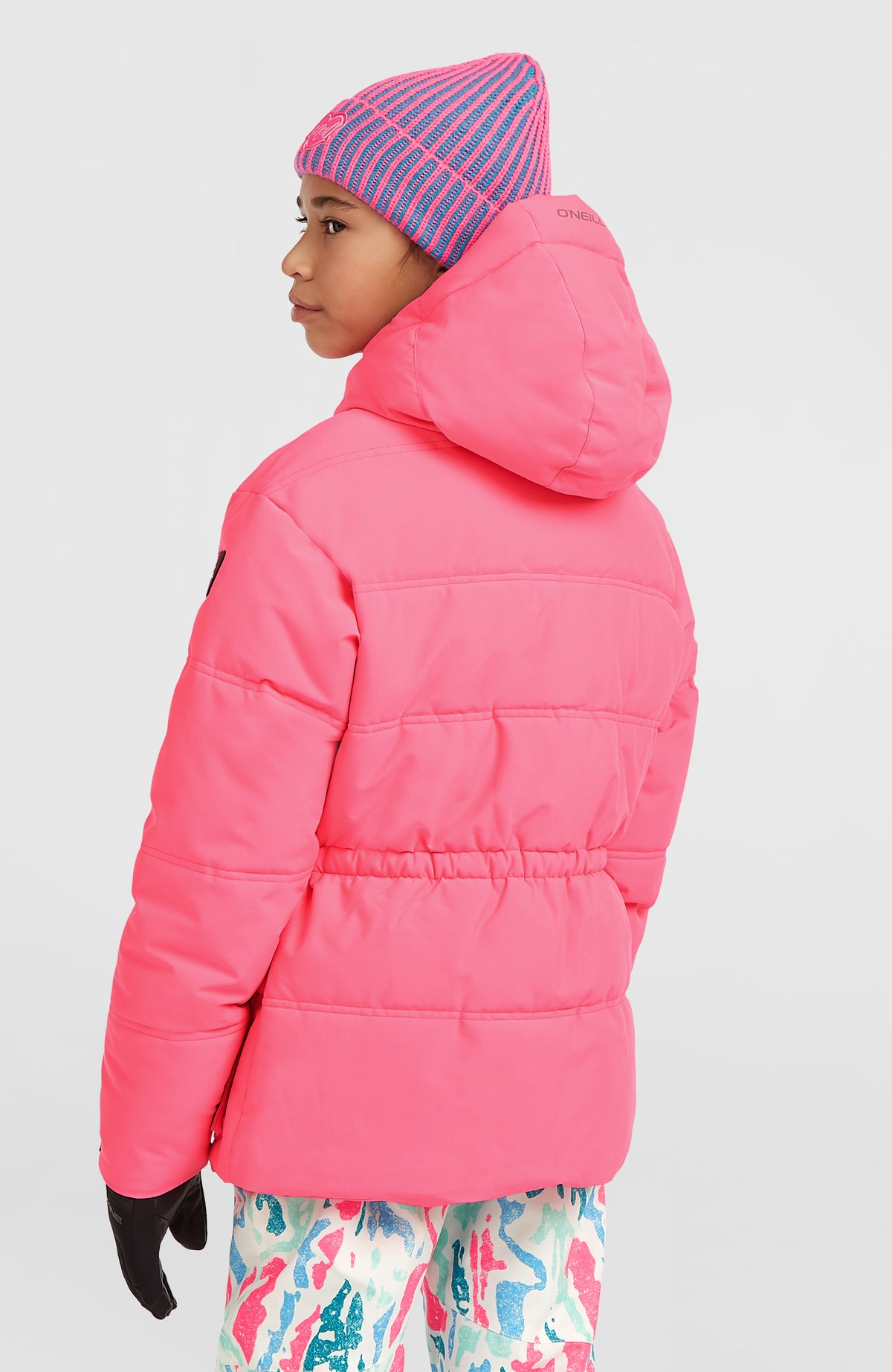 Gesteppte FWC'Cruz Skijacke für Mädchen, pink, Rückansicht am Model mit elastischem Taillenzug