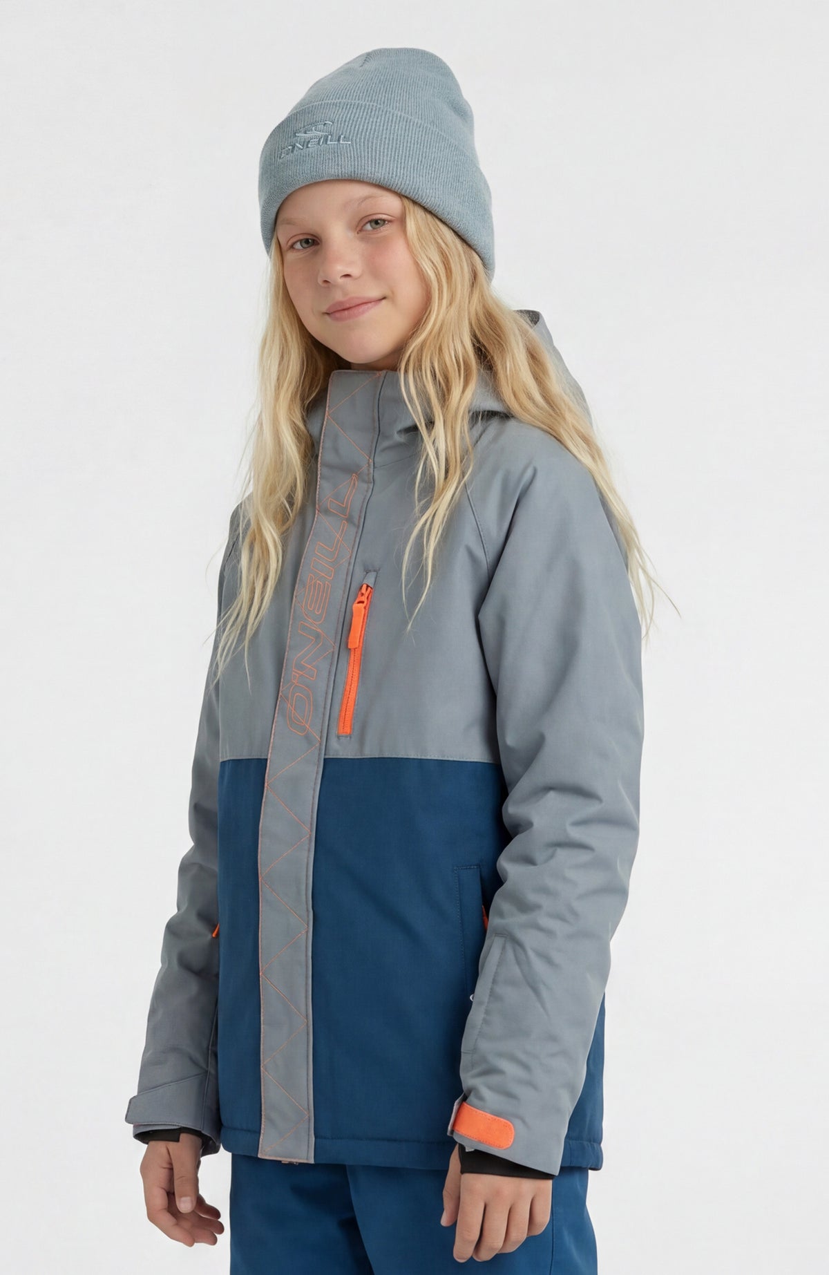 FWC'Cruz Raglan Skijacke für Mädchen, blau, Halbprofil am Model, Brusttasche mit Reißverschluss