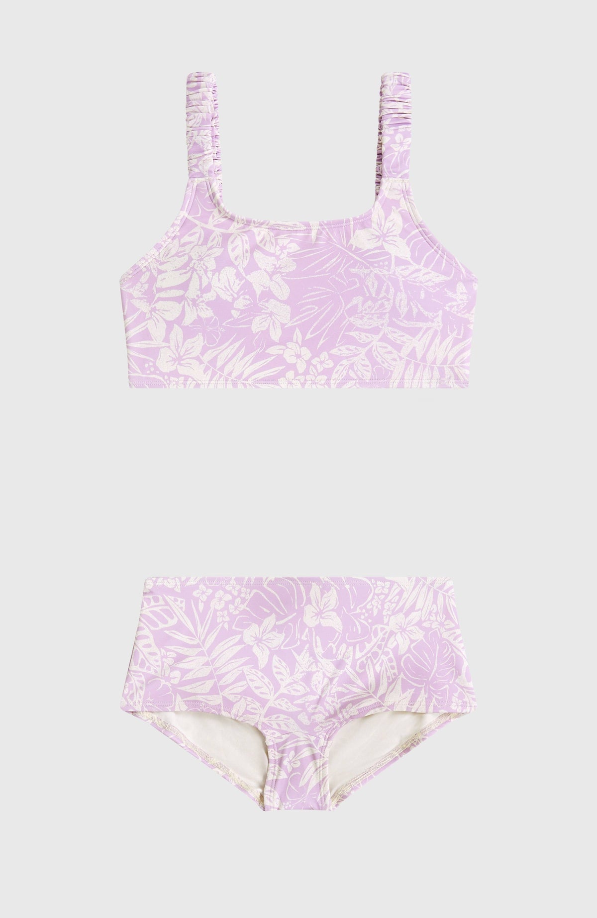 Holiday Bikini-Set für Mädchen, lila mit Blumenmuster in Weiß, flach liegend von vorne, Crop-Top und Badeshorts
