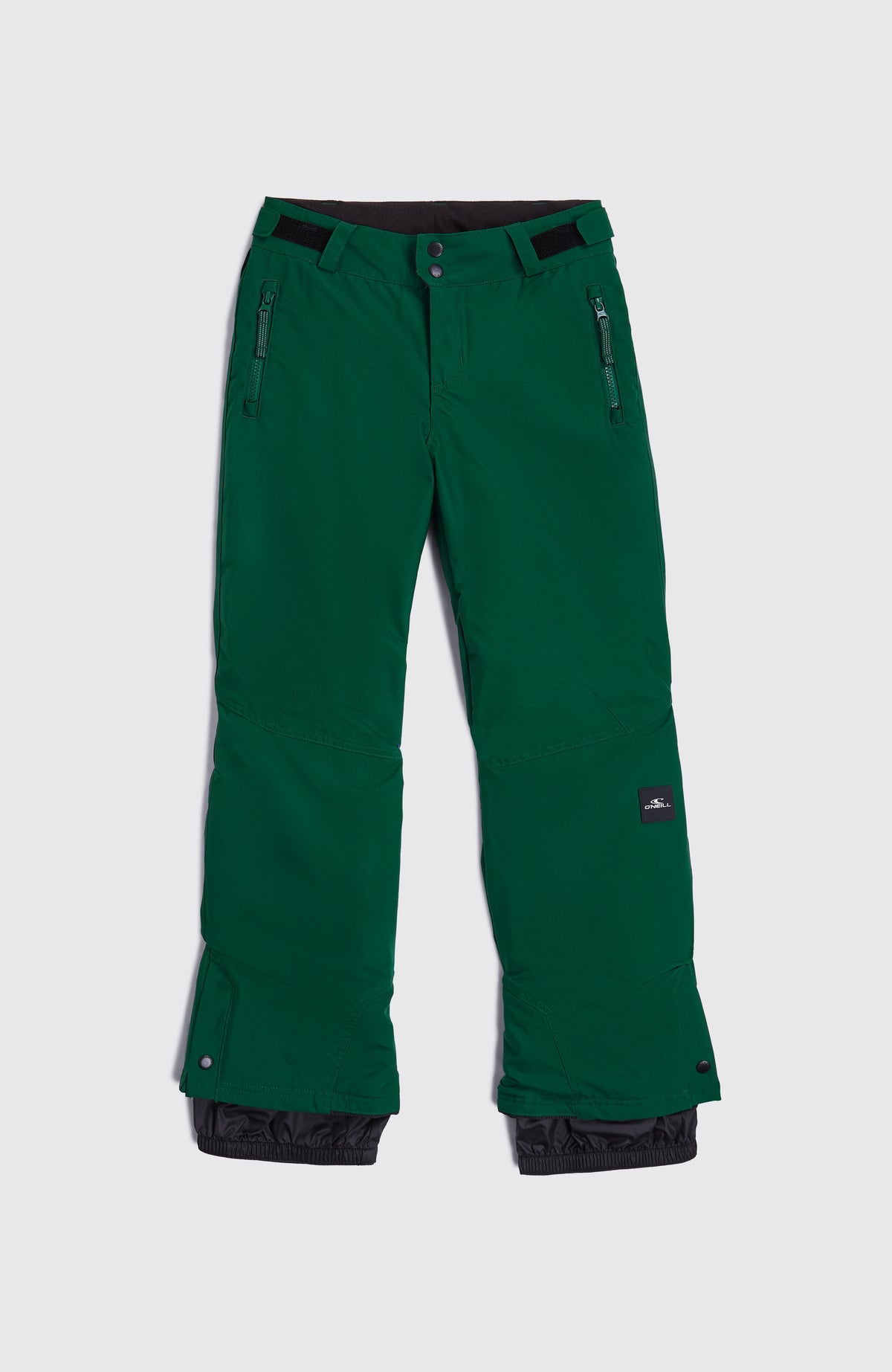 Grüne FWC'Cruz Skihose für Jungen, flach liegend von vorne mit Schneefang an den Beinabschlüssen