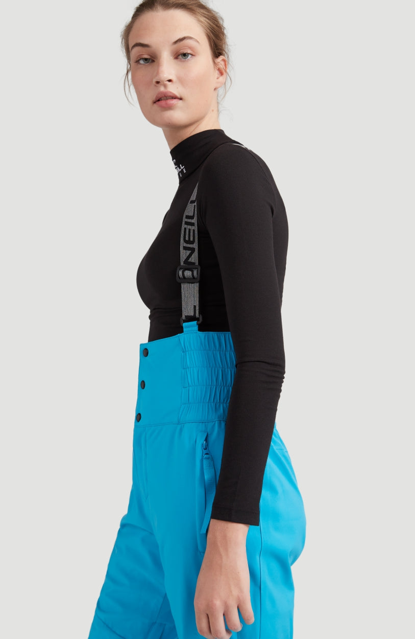 Ocean Mission Snow Pants Schneehose für Damen, türkis, Seitenansicht am Model, hoher Bund mit Druckknöpfen