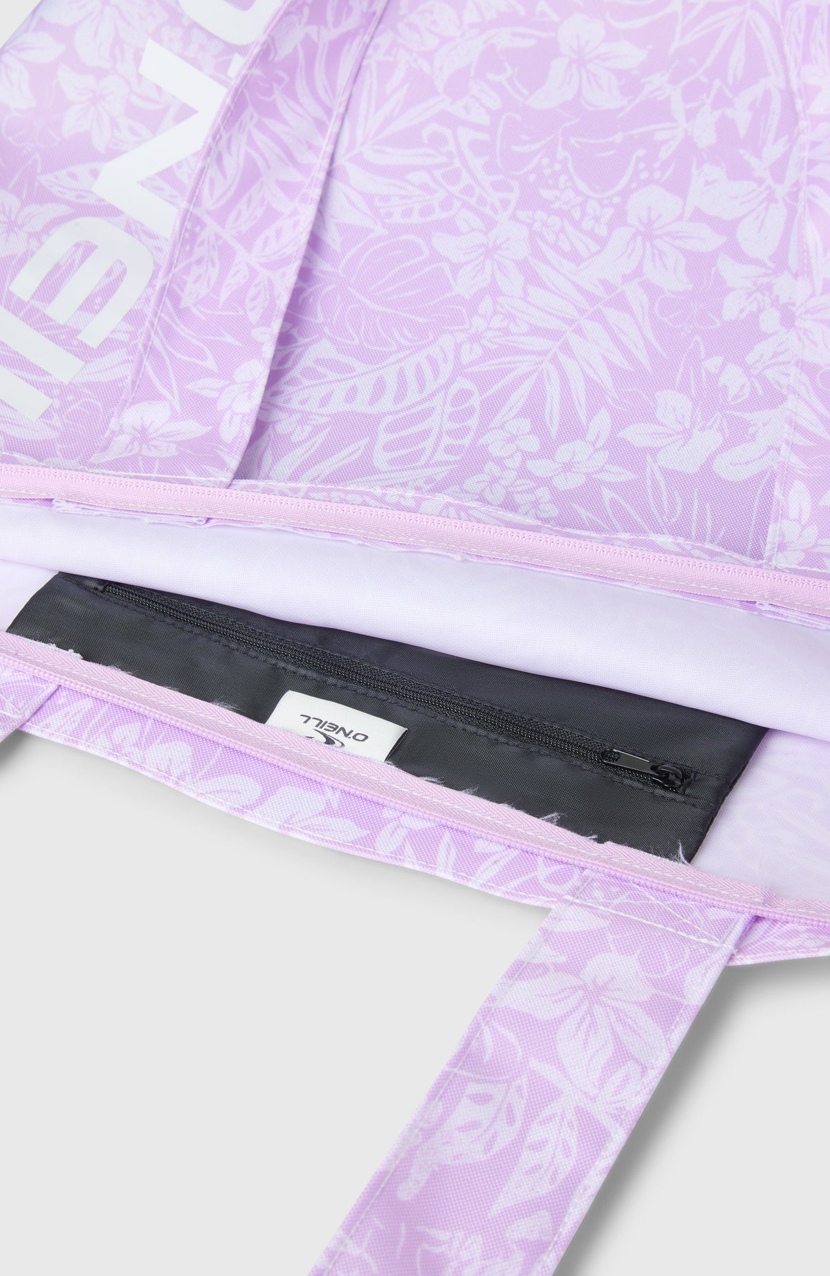 Nahaufnahme der lila Coastal Print Tote Bag Tasche mit Blumenmuster in Weiß und Reißverschluss-Innentasche
