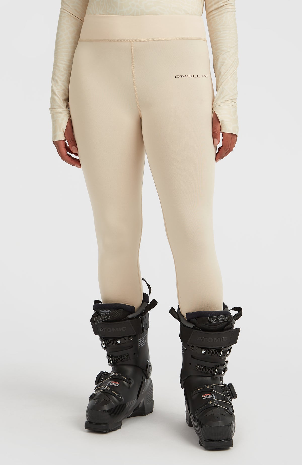 Thermounterhose für Damen, beige, Vorderansicht am Model mit dezentem Logo-Schriftzug