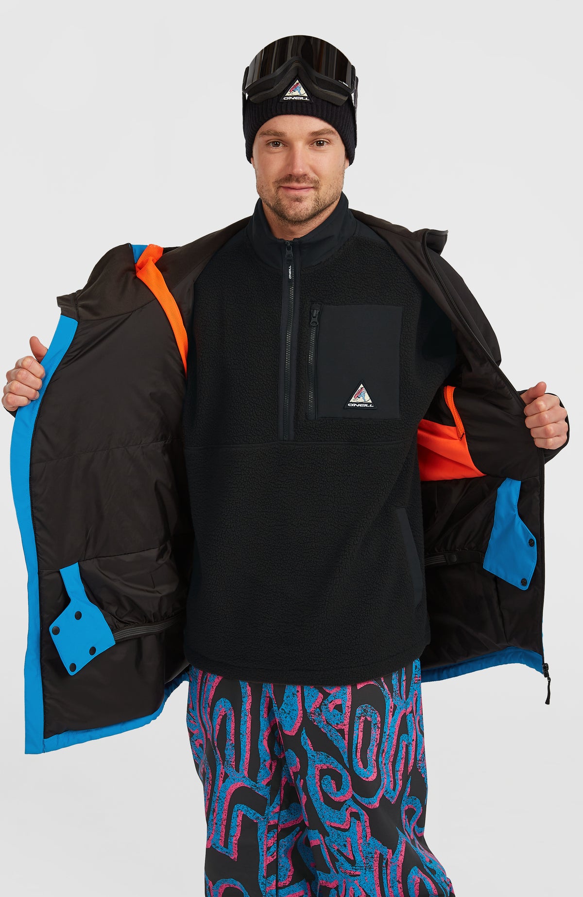 FWC'Play Asymmetric Ski- und Snowboardjacke für Herren, blau, geöffnete Jacke mit Blick auf das Innenfutter