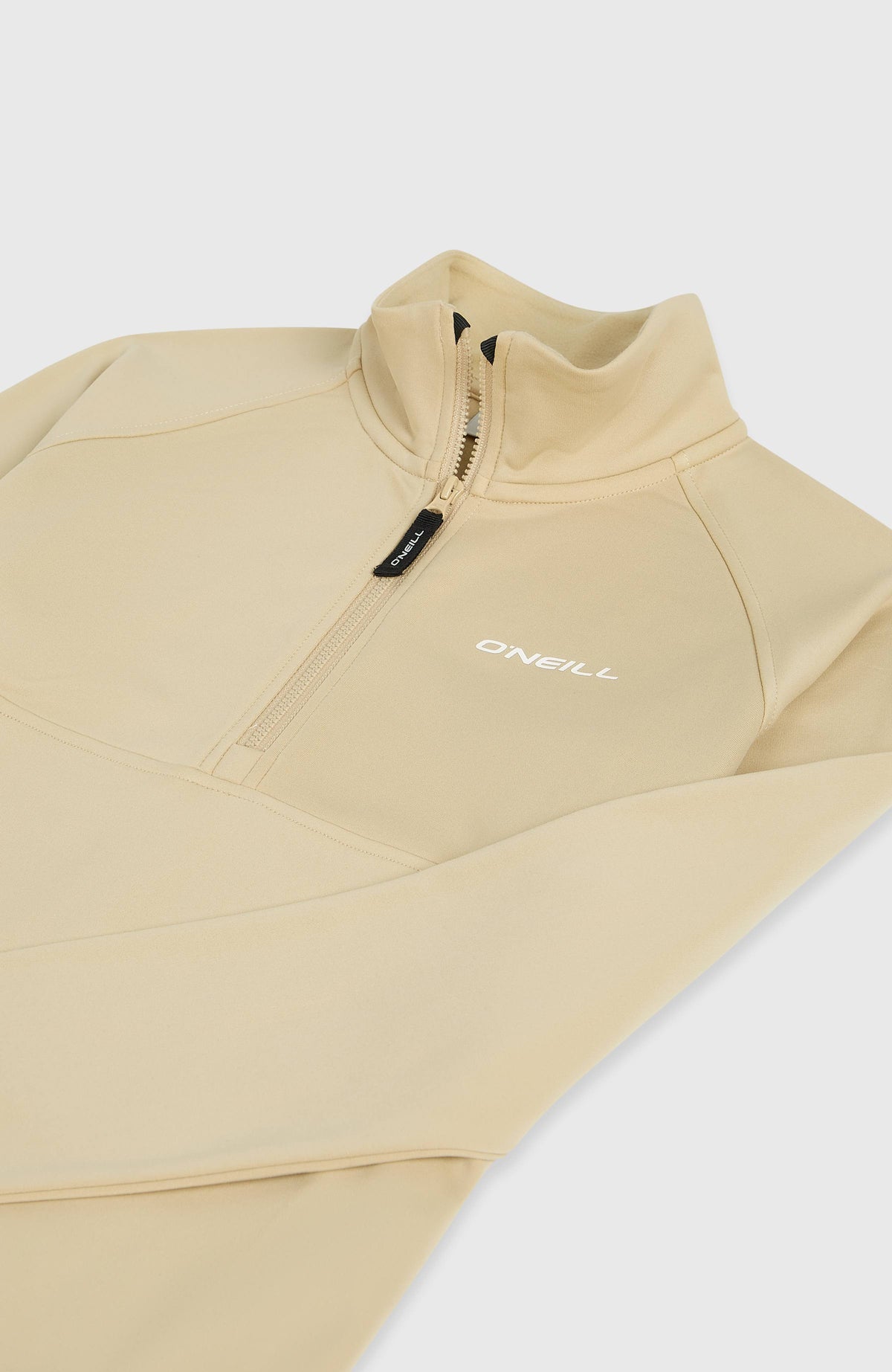 FWC'Cruz Fleecepullover für Mädchen, beige, freigestellt von schräg oben mit Fokus auf Kragen und Zipper