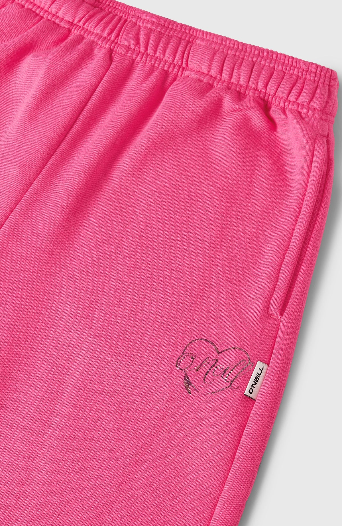 Essentials Jogginghose für Mädchen, pink, Nahaufnahme von elastischem Bund, Seitentasche und Logo-Print
