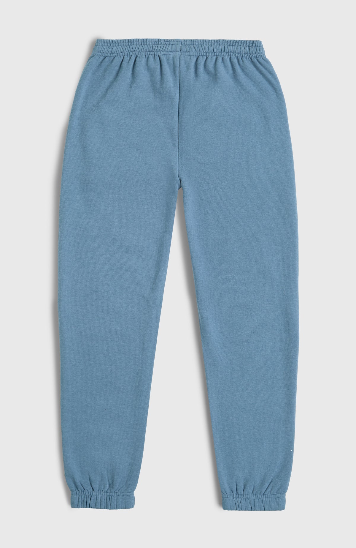Blaue Essentials Jogginghose für Mädchen, flach liegend von hinten mit elastischem Bund und Bündchen