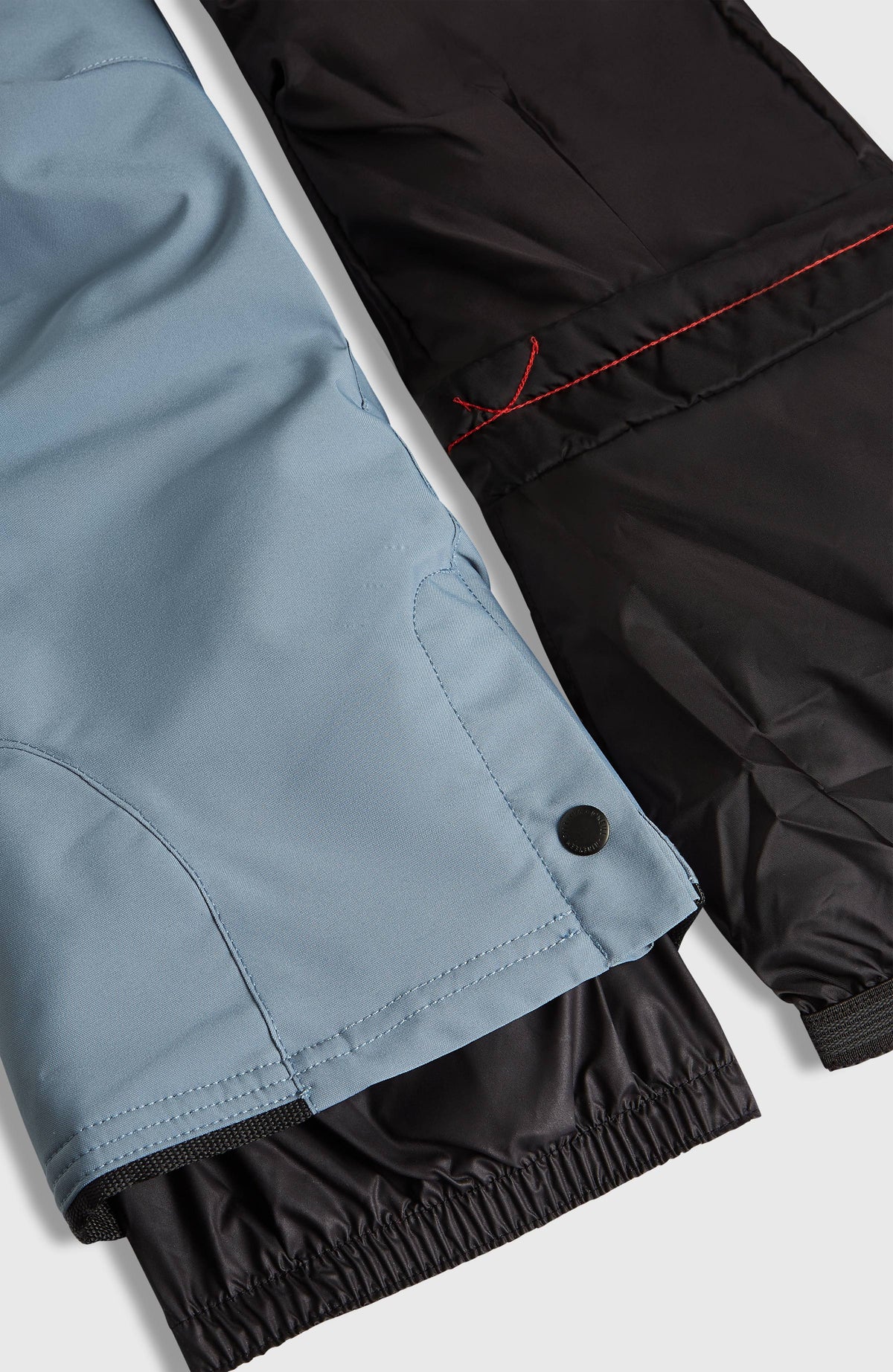 FWC'Cruz Skihose für Mädchen, blau, Nahaufnahme des Beinabschlusses mit Druckknopf