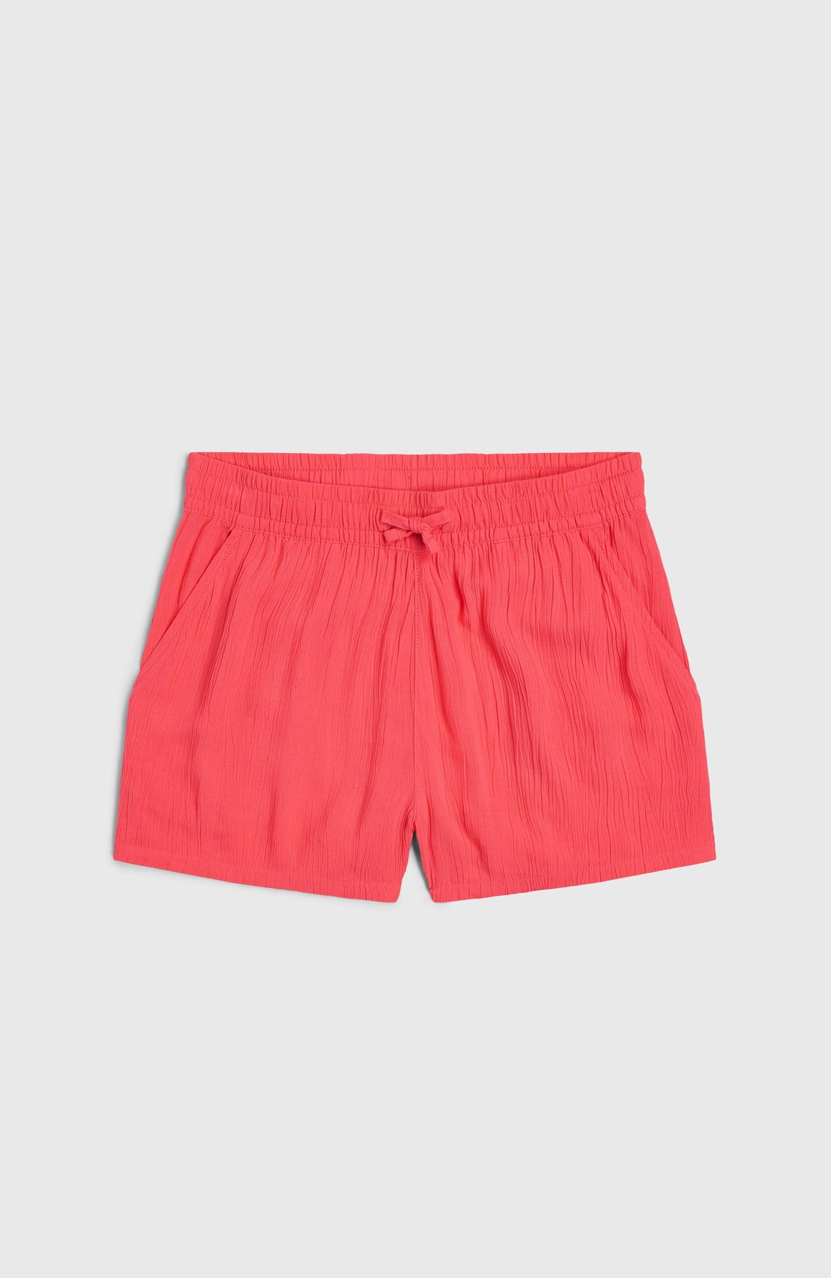 Gewebte Sommershorts für Mädchen, pink, flach liegend von vorne mit Kordelzug am Bund
