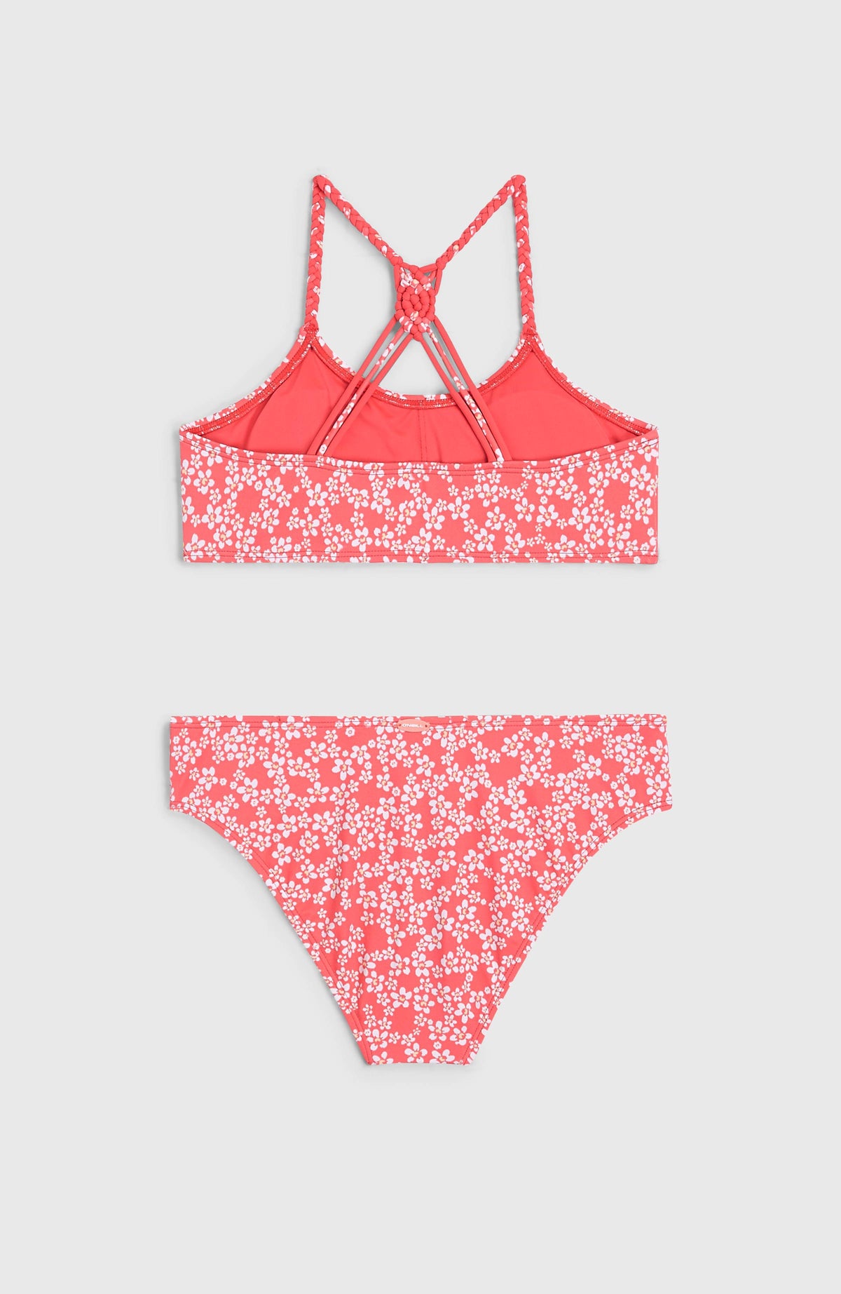 Tropics Bikini-Set für Mädchen, pink mit Blumenmuster in Weiß, flach liegend von hinten mit Trägerdetail