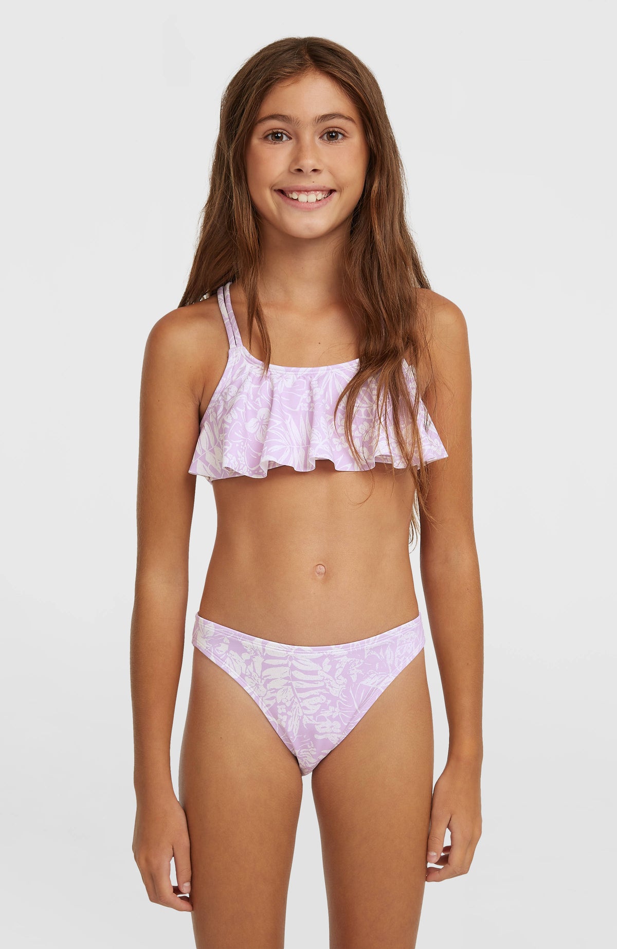 O'Neill Tropics Bikini-Set für Mädchen, lila mit Tropenmuster in Weiß, Vorderansicht am Model