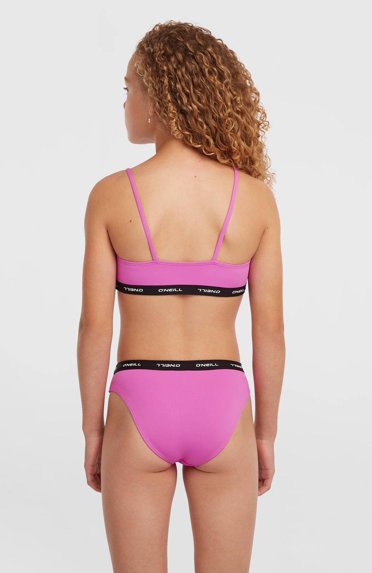 Sport Bikini-Set für Mädchen, lila, Rückansicht am Model mit elastischem Bund an Hose und Oberteil