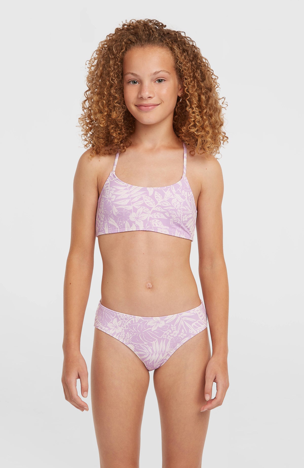 O'Neill Essentials Bralette-Bikini-Set für Mädchen, lila mit Blumenmuster in Weiß, Vorderansicht am Model