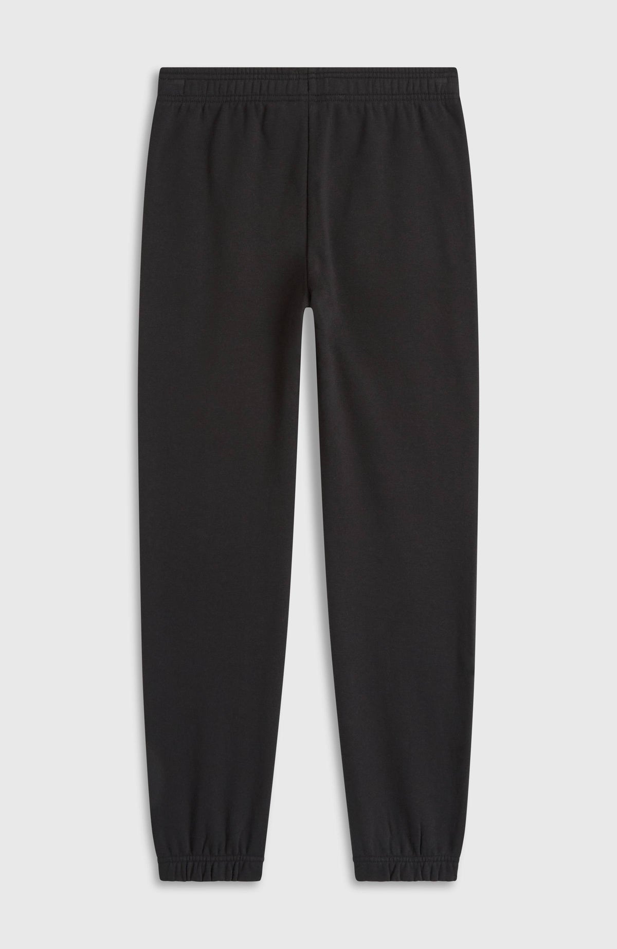Schwarze Essentials Jogginghose für Jungen, flach liegend von hinten, elastischer Bund und Beinabschlüsse