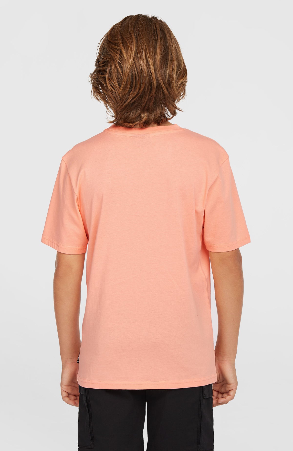 Graphic T-Shirt für Jungen, pink, Rückansicht getragen am Model mit kurzen Ärmeln und unifarbener Rückseite
